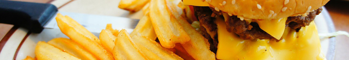 Eating Burger Caribbean at Jerkin Chicken restaurant in Jersey City, NJ.